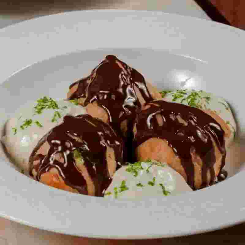 profiteroles-with-cream-filling-and-chocolate.webp