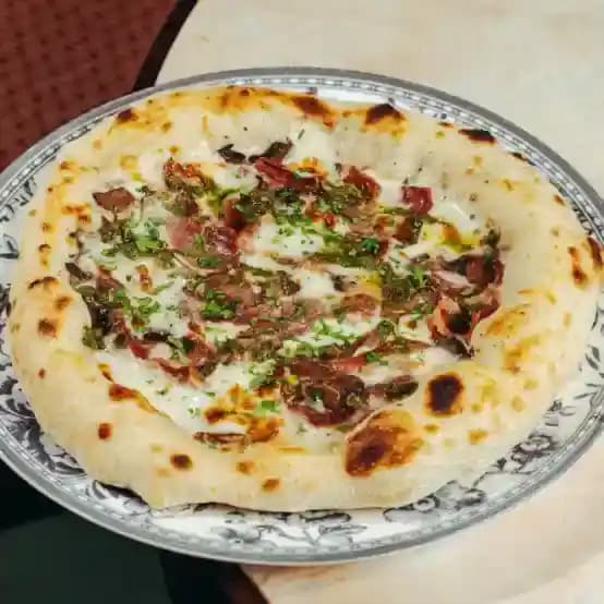meals/20260609103559-pizza-with-truffle-sauce-bacon-and-mushrooms.webp