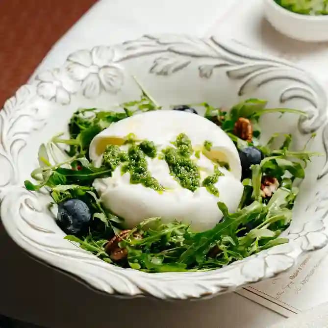 meals/20260721103238-burrata-with-arugula-fresh-blueberries-and-pecans.webp
